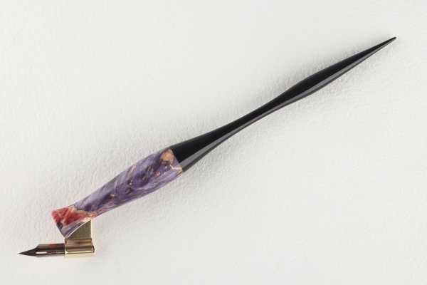 Pen holder made of stabilized maple burl and african ebony wood.