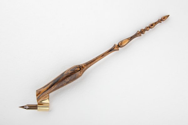 Pen holder made of bocote wood and finished with natural wax.