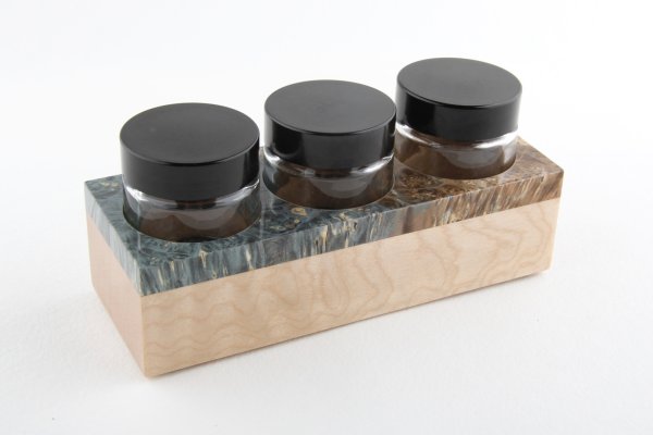 Inkwell made of stabilized maple burl and curly maple wood. Finished with a clear coat.